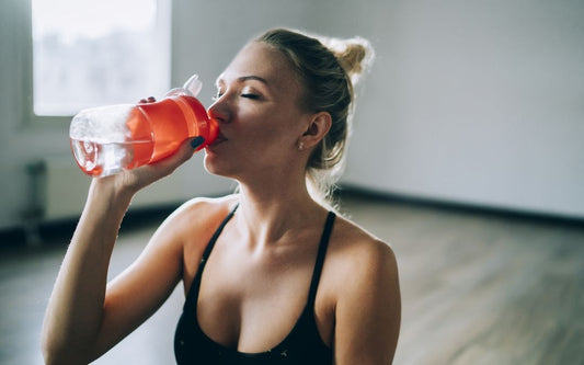 Woman drinking Hydralyte